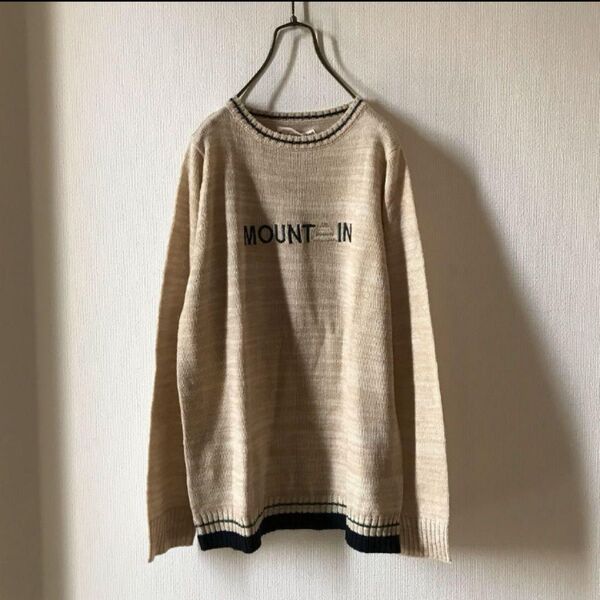 Emago/イマゴ 胸元ロゴ刺繍ニットプルオーバー ベージュ クルーネック セーター ニット 長袖 無地 ロゴニット レディース