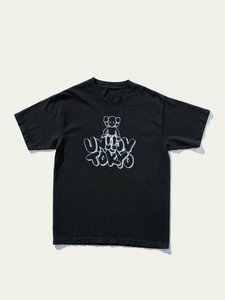 KAWS (カウズ) x UNION (ユニオン) Tokyo T-Shirt - Black / XL