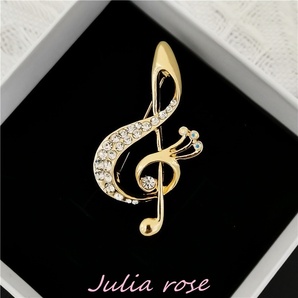ト音記号ブローチ ゴールドカラー(金属部分) 軽やかなデザイン ラインストーン 新品