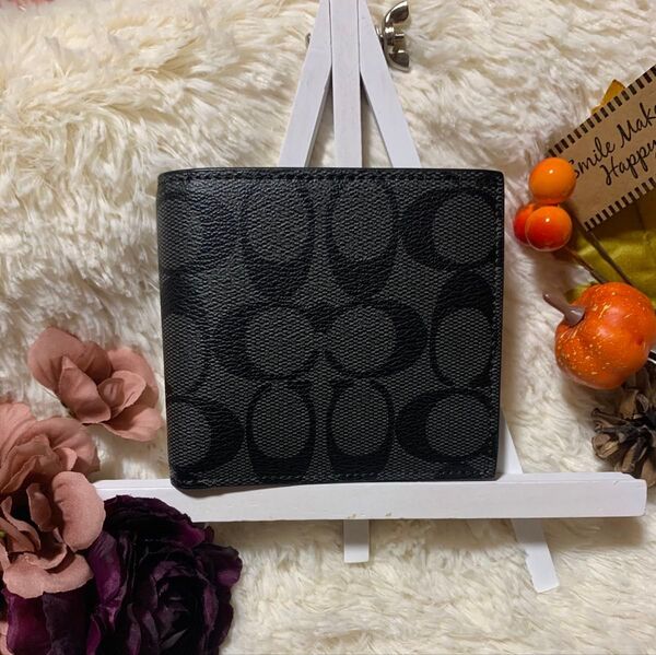 ☆新品未使用☆COACH 黒 折り財布 2つ折り メンズ レディースシグネチャー