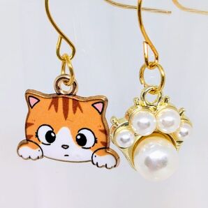 パールの肉球とおめめパッチリ茶トラの猫ピアス