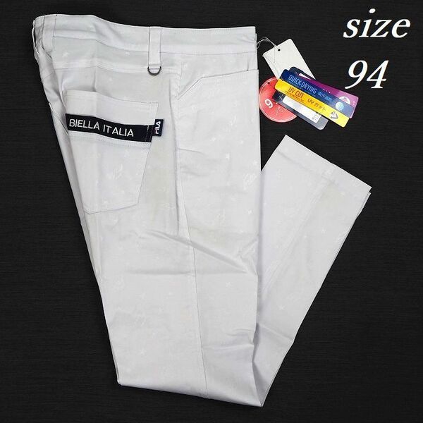 R740 新品 FILA GOLF フィラ ゴルフ 総柄 9分丈 テーパード ストレッチ パンツ Dカン ホワイト 94