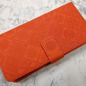 送料込み グーグル Pixel8 用 手帳型 ケース 浮き彫り調 アラベスク オレンジ