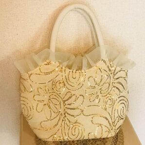 未使用品 ゴールド スパンコールが華やかなハンドバッグ フリル付き