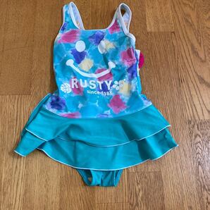 RUSTY (ラスティ) キッズ 水着ワンピース ニコちゃん水彩画柄 エメラルドグリーン 110 1枚