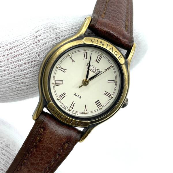 【電池切れ】SEIKO セイコー ALBA アルバ SUCCESS サクセス クォーツ腕時計 ゴールド×アイボリー文字盤 ローマン レザーベルト V701-6650