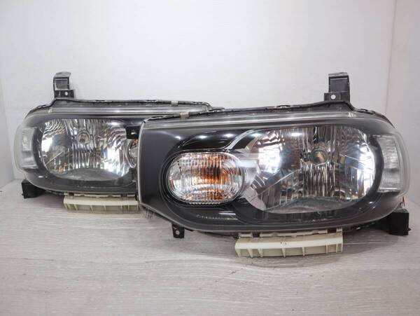 キレイ 【コーティング済】 レベライザー ハロゲン 迅速発送 車検〇 STANLEY P8190 管理BR40-22 キューブ Z12 ヘッドライト 左右