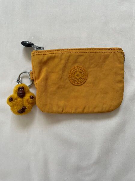 Kipling ミニポーチ イエロー モンキーチャーム付き