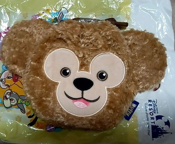 新規・評価10以下取引不可【新品・タグ付き・未使用】東京ディズニーシー ダッフィー お顔型の巾着 きんちゃくポーチ