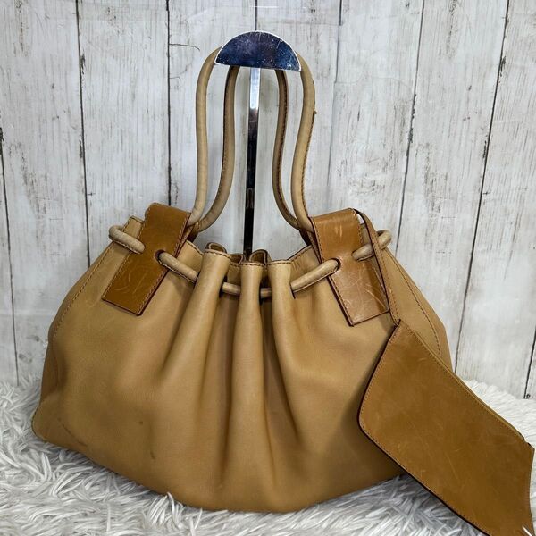GUCCI 巾着 ハンドバッグ ショルダーバッグ レザー 型押しロゴ