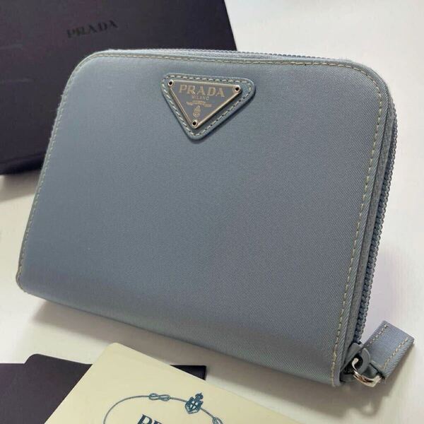 ★美品 PRADA プラダ ラウンドファスナー ジップ 財布 三角ロゴ トライアングル ライトブルー系【鑑定済み 本物保証】