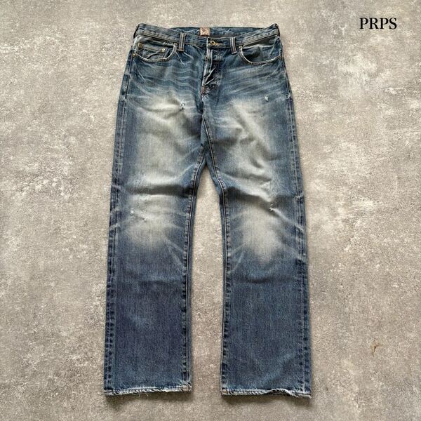 【PRPS】ピーアールピーエス ダメージリペア デニムパンツ ジーンズ ボタンフライ ドーナツボタン レザーパッチ 革 ヒゲハチノス (W32)