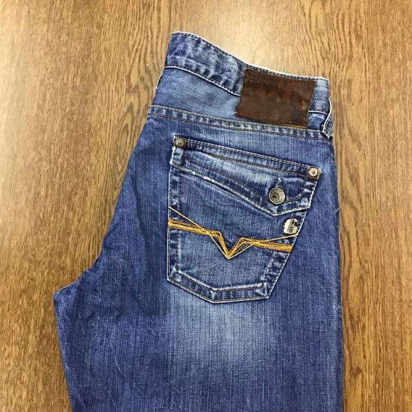 【GE074】USA製 GUESS W32 色落ち加工 ダメージ加工 ブーツカット ジーンズ ジーパン デニムパンツ ストレッチ ブランド古着 ゲス 送料無料