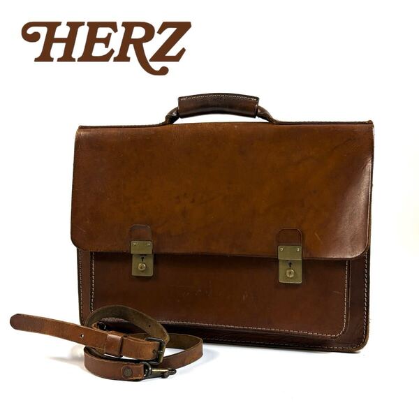 HERZ ヘルツ レザー 2WAY ブリーフケース ビジネスバッグ ショルダーバック ハンドバッグ フラップ式 ヌメ革 ブラウン ゴールド金具