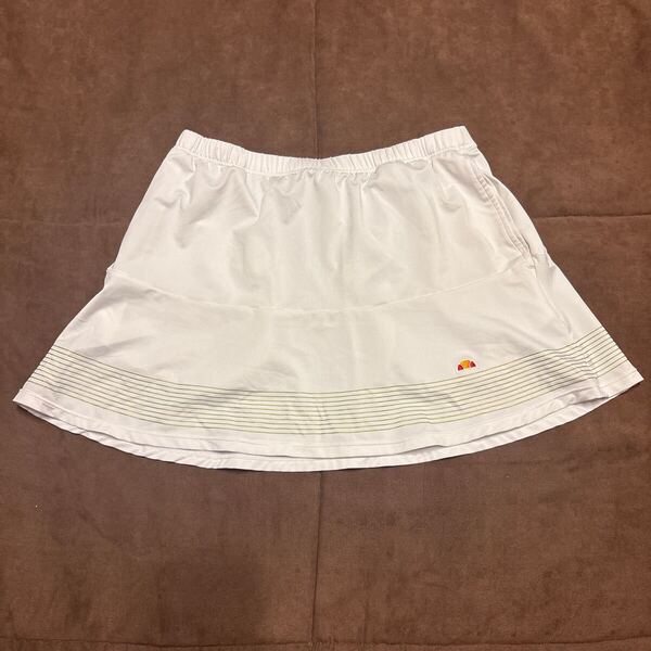 ellesse エレッセ テニス レディース スコート サイズM ホワイト×ゴールドストライプ ETL23350