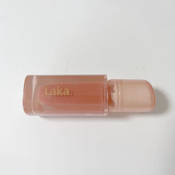 Laka / ジェリーイングヌードグロス #303 ももリング:ピンク系 ぷるぷるとした弾性が感じられる透明オイルの輝き 定価1980円
