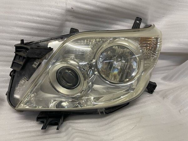 ランクルプラド150系 TRJ150W/GRJ150W/GRJ151W 前期 左ヘッドライト ヘッドランプ ハロゲン81150-60L50 60-156 刻印:C
