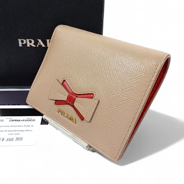 箱付き 正規品 プラダ PRADA 折り財布 サフィアーノ ピンク リボン 革 レザー カード付き ミニウォレット 小さめ レディース財布 赤 レッド