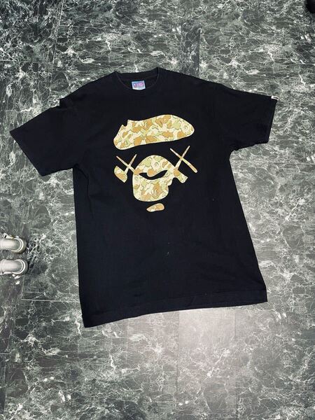 A BATHING APE×KAWS Tシャツ ビッグフェイス カモフラ L