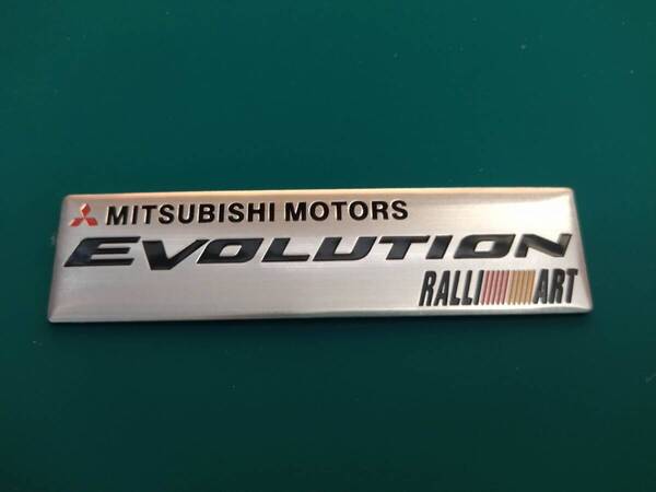 【ゆうパケット送料込】MITSUBISHI MOTORS EVOLUTION エンブレムプレート 縦2.5cm×横10.2cm×厚さ1mm 三菱 ラリーアート