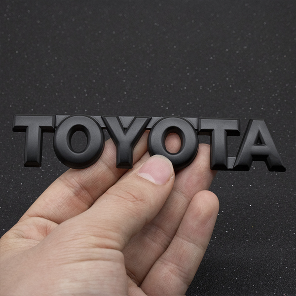【ゆうパケット送料込】TOYOTA 3Dエンブレム(両面テープ付) マットブラック 縦2.4cm×横12cm 金属製 トヨタ 豊田