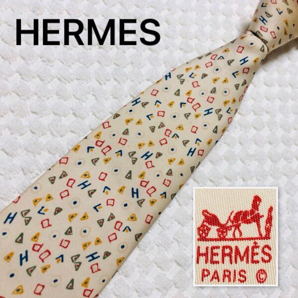 HERMES エルメス ネクタイ Hロゴ 図形 総柄 シルク100% フランス製 5044 PA ベージュ×マルチカラー ビジネス