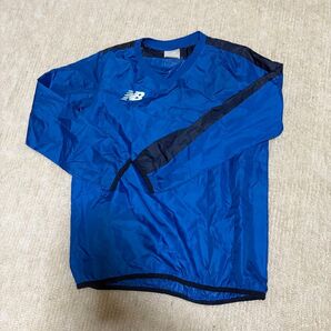 New Balance ウインドブレーカー ブルー ピステ