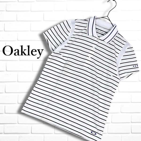 良品◆ Oakley オークリー ゴルフ ウェア ロゴ 刺繍 半袖 ストレッチ ボーダー ポロシャツ 白 黒 ホワイト ブラック レディース M 1255E◎