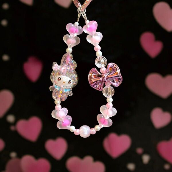 ラメラメ クリアピンク My melody フロストダブルビーズハート メタリックピンクリボンのストラップ 軽量ハンドメイド