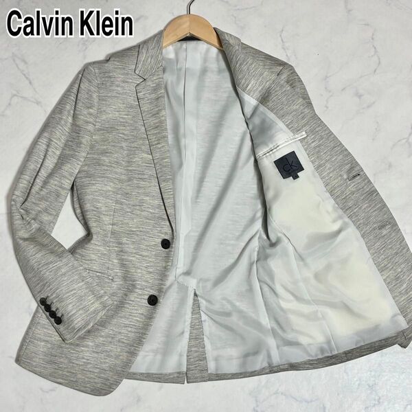 美品CK Calvin Klein カルバン・クライン テーラードジャケット ジャージー ストレッチ 杢柄 杢グレー M 洗える