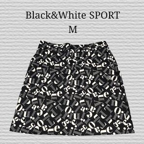 《BLACK&WHITE》SPORT 英字総柄 ラインストーンロゴ ストレッチ ストレッチスカート ゴルフウェア ブラック系