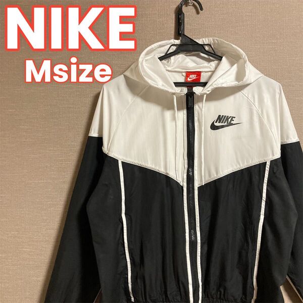 179 NIKE ナイキ ナイロンジャケット レディース M ブラック ホワイト フード ジップアップ 長袖