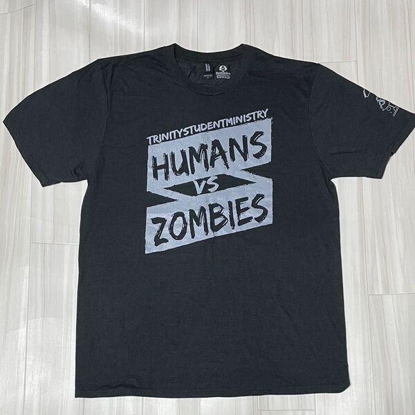 アメリカ直輸入両面プリントTシャツUSサイズL身幅約54、着丈約72、ユーズド品洗濯済スタッフ用非売品。プリント部分他全体的に綺麗