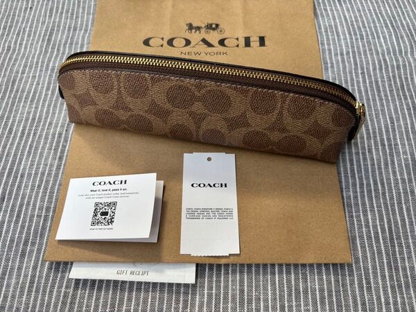 新品 COACH プラウン ペンケース シグネチャー コーチ