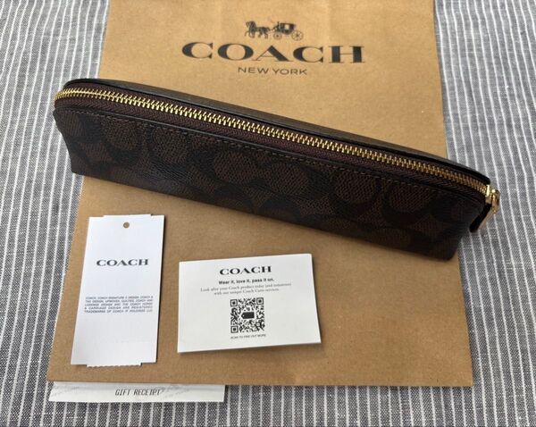 新品 COACH ペンケース ダークブラウン シグネチャー コーチ