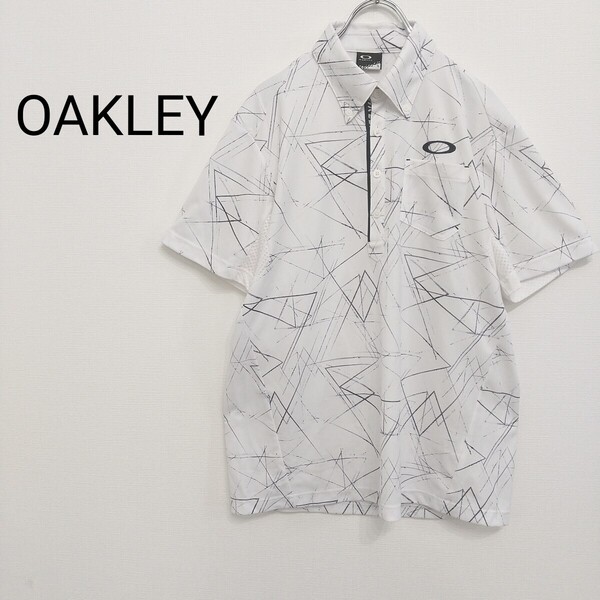 【410】美品 OAKLEY オークリー 半袖ポロシャツ 総柄 ゴルフウェア トップス 刺繍ロゴ メンズL 白 テックウェア 春夏