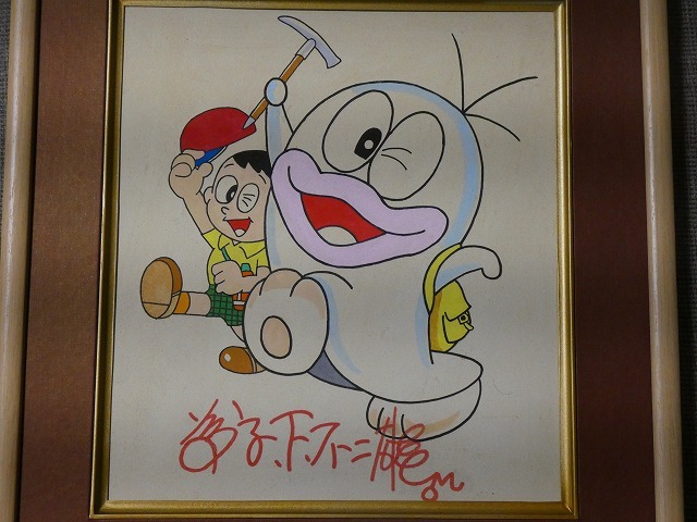 ドラえもんのセル画と藤子不二雄さんのサイン(印刷物)