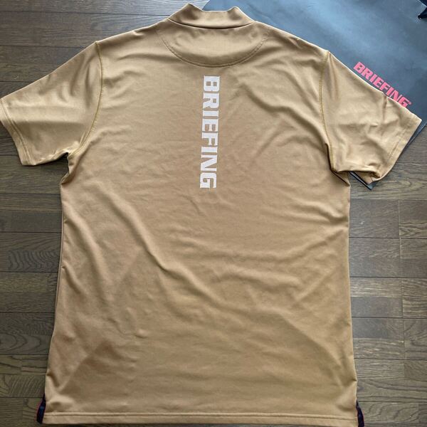 送料無料BRIEFINGブリーフィングMENS TOUR背面BIGLOGOハイネック半袖シャツ吸水速乾拡散DRY弾力性STRETCH希少COYOTE(大特価XL)1try中古品