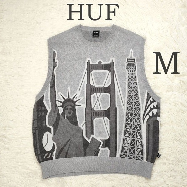 極美品 HUF ハフ ベスト WORLD TOUR SWEATER VEST M グレー 自由の女神 総柄 丸首 お洒落 未使用級 ニットベスト トップス ユニセックス