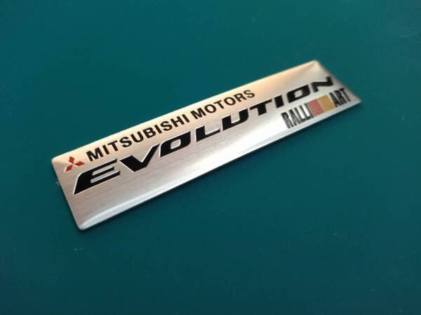 【ゆうパケット送料込】MITSUBISHI MOTORS EVOLUTION エンブレムプレート 縦2.5cm×横10.2cm×厚さ1mm 三菱 ラリーアート