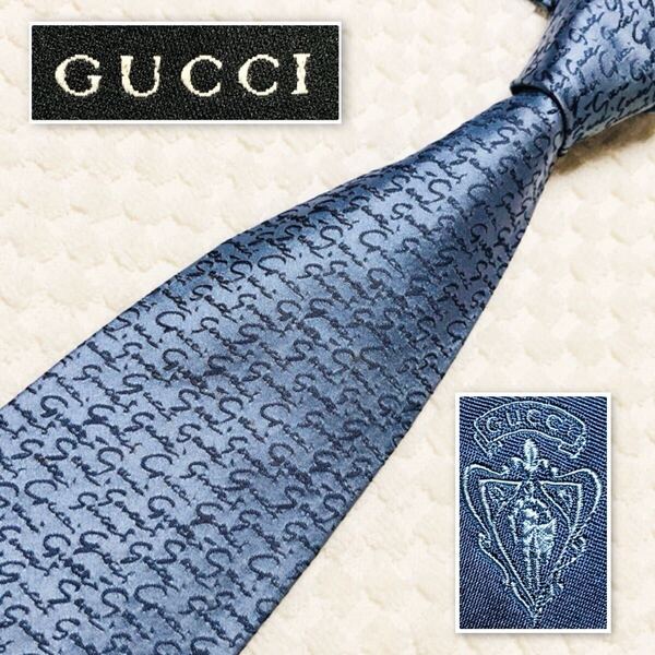 GUCCI グッチ ネクタイ 筆記体 ロゴ 総柄 シルク100% イタリア製 ライトブルー ビジネス