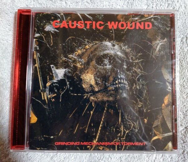 CAUSTIC WOUND / GRINDING MECHANISM OF TORMENT デスメタル グラインドコア