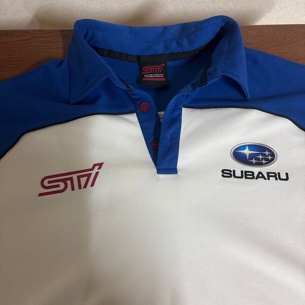 スバルSTI・ジップアップドライ襟付きTシャツサイズL 新同美中古 ジャケット・WRC