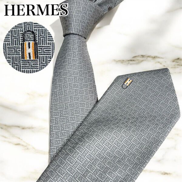美品 HERMES エルメス ネクタイ ナロータイ H柄 カデナ 南京錠 現行 シルク 光沢感 グレー 339343T 結婚式