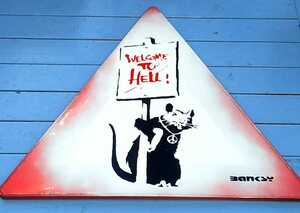 Banksy( Bank si-). load autograph,[Welcome To Hell] road sign.2004 year about England. south west,Somerset close. Glastonbury. discovery was done work 
