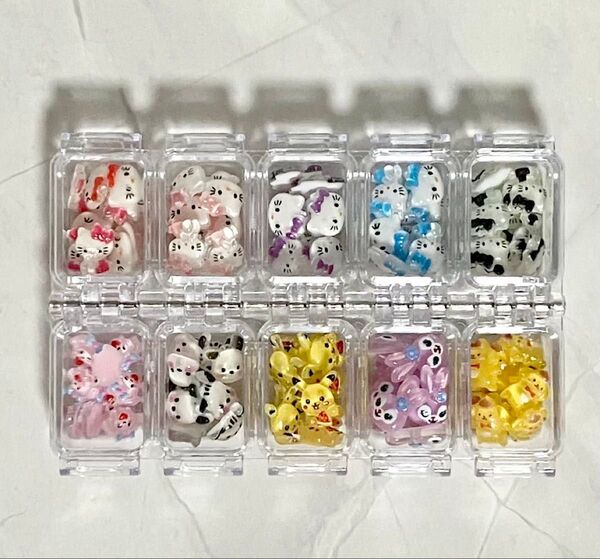 【NP15】キティ ポチャッコ ピカチュウ等 キャラネイルパーツ デコパーツ 100個セット ケース付き