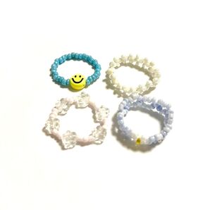 4個セット ビーズリング リング 指輪 アクセサリー ジュエリー まとめ売り 水色 ピンク 花 ニコちゃん スマイリーフェイス