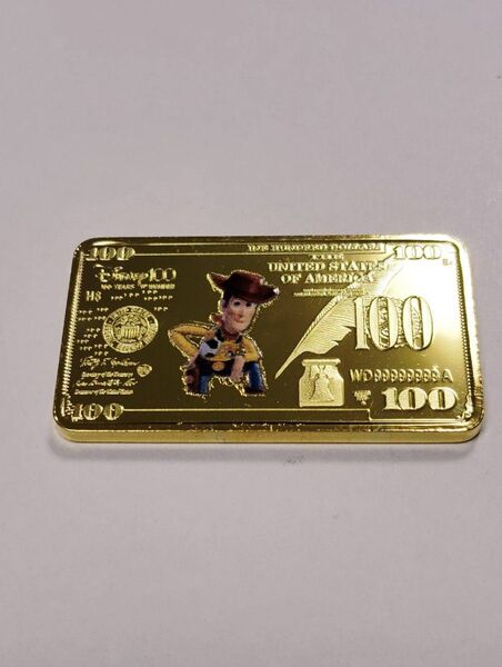 ウッディ 金コイン 100ドル札 トイストーリー ディズニー