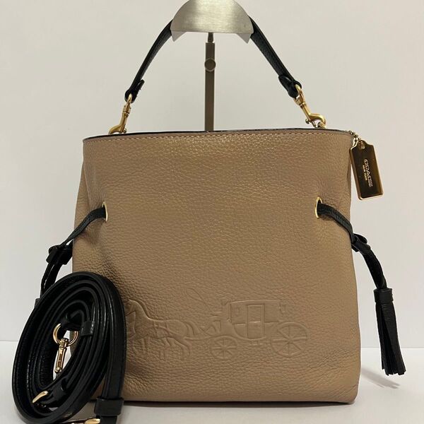 未使用級 COACH コーチ アンディ 2way ショルダーバッグ ハンドバッグ 巾着 タッセル 通勤通学 型押し ベージュ