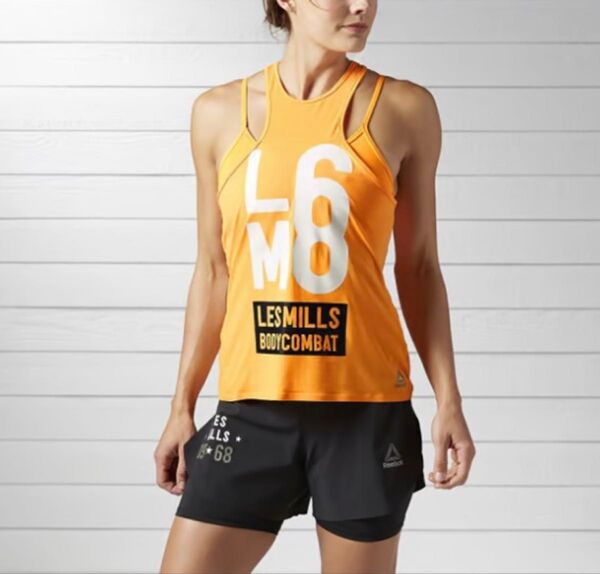 新品タグ付き Reebok × LES MILLS BODYCOMBAT タンクトップ S オレンジ系